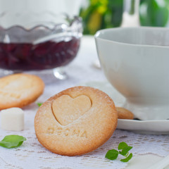 Homemade shortbread cookie with the inscription in Russian 