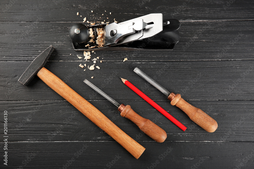 Poster set of carpenter's tools on wooden background