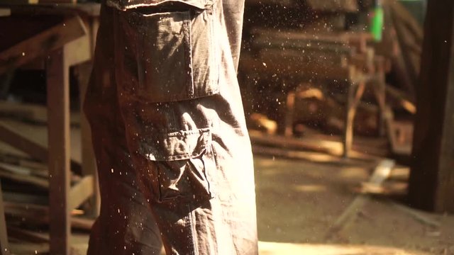 Carpenter working on a Wooden in his Workshop, preparing a detail of wooden product, Cabinet maker planes