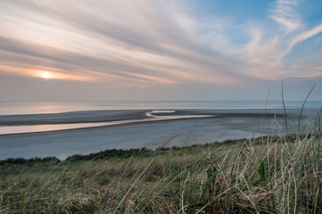 The beach at the Maasvlakte near Rotterdam in the Netherlands during sunset.