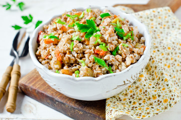 Buckwheat stewed with vegetables: zucchini, carrots, bell peppers, tomatoes and onions