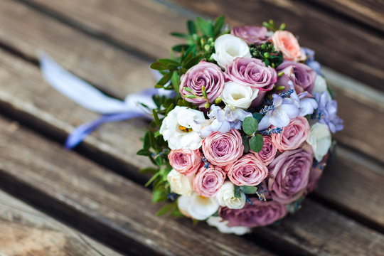 Wedding bouquet on a wooden background