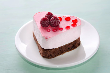 nice small cake in the form of heart  on the table