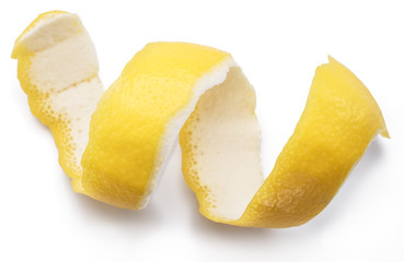Lemon peel or lemon twist on white background. Close-up.