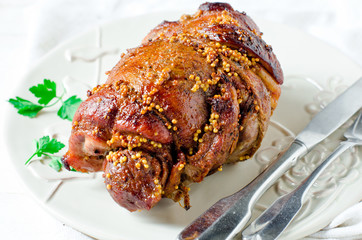 Baked roll from a turkey thigh with a grain mustard