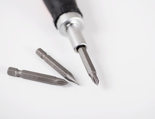 Naklejka premium Close-up of set of heads for screwdriver on white background. Isolated. Industry.