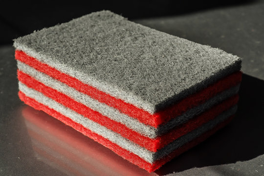 a set of grey and red scouring pad for household accessory