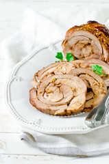 Baked roll from a turkey thigh with a grain mustard