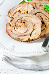 Baked roll from a turkey thigh with a grain mustard