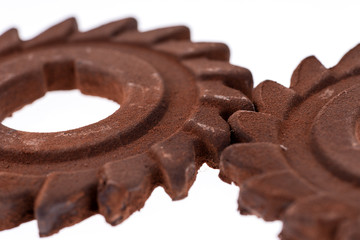 Two incredible rusty chocolate gears. Isolated on white