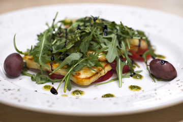 Salad with rucola grilled cheese and tomato
