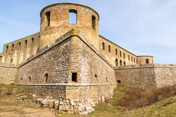 Historic castle ruin at Borgholm, Oland in Sweden. A corner of the perimeter wall and a tower seen from the outside. A popular travel destination with historic values.