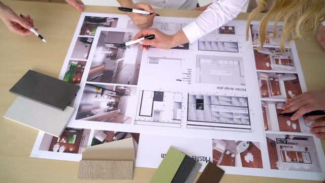 Close Up Of four Architects Discussing Plan Together At Desk With Blueprints 4 k Blueprints of kitchen, kitchen design