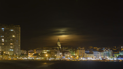 Fototapeta na wymiar Night scene from a small mediterranean town Palamos in Spain