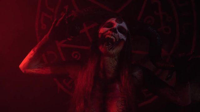 The girl in the image of Satan with big horns boasts of its beauty, the concept art