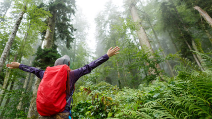 Image from back of woman with backpack