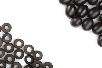 whole and sliced black olives isolated on white background with copy space for your text. Top view. Flat lay pattern