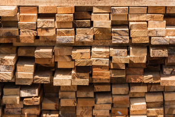 Pile of cut wood for construction ( texture, background, pattern).Thailand.