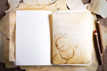 Vintage old papers, notes, pensil, on burlap, sackcloth background. Vintage and retro design effects.