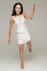 Beautiful fashionable woman in a white dress