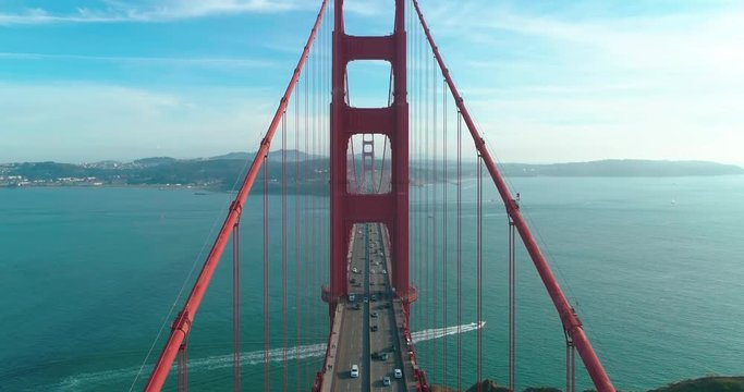 Flight through bridge resistance. Aerial view of the Golden Gate Bridge in fog. San Francisco. Drone. California. USA. 4K