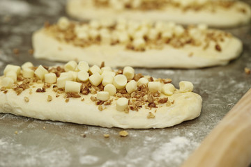 Fototapeta na wymiar Nuts and cheese bread dough 
