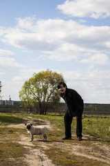 Obraz premium Teenager walks with a dog