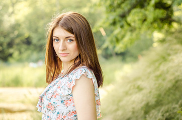 Fototapeta premium fashionable young healthy woman smiling in stylish trendy dress on the background of nature