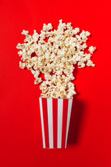 popcorn on color background