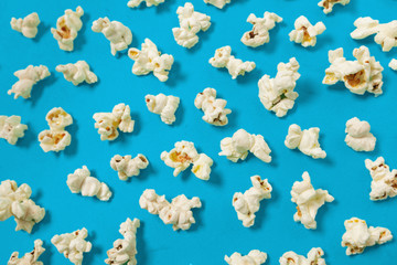 popcorn on color background