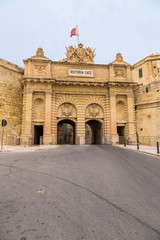 Naklejka premium Valletta, Malta. The Gate of Victoria, 1885. The city is wholly included in the UNESCO list