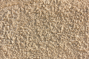 Rough Stone Texture Background of Pale Brown Colored Pattern Surface. Old Building Wall Structure Close Up View, Seamless Textured Backdrop. Empty Horizontal Template Wallpaper with Copy Space.