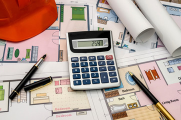 orange helmet, construction drawing, calculator, pen