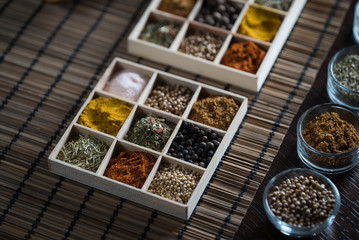 Wooden table of colorful spices