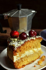 Sponge cake with cream and cherries
