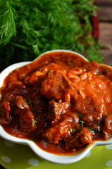 Goulash in white bowl