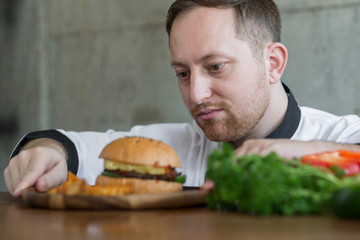 Chef checking up meat burger before serve, work lifestyle concept.