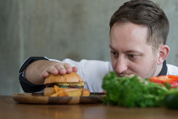 Chef checking up meat burger before serve, work lifestyle concept.