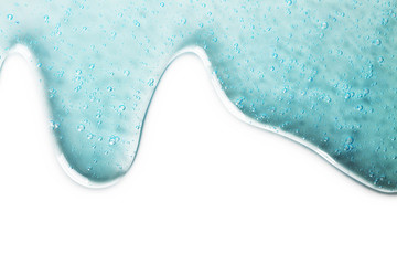 Oxygen bubbles in clear blue water, close-up. Mineral water. Water enriched with oxygen. pouring...
