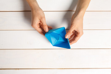Process of handcrafting origami paper boat