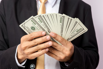 Businessman with money in studio . Business concept