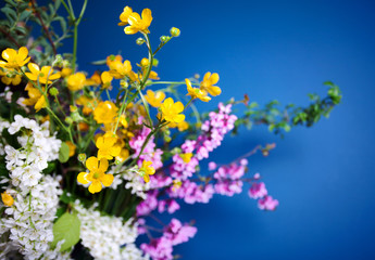 Spring bouquet on blue background