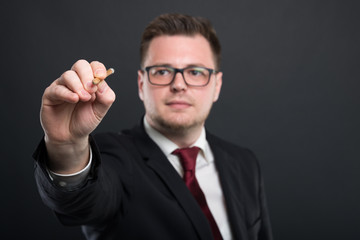 Selective focus of business young man writing with graphic pencil.