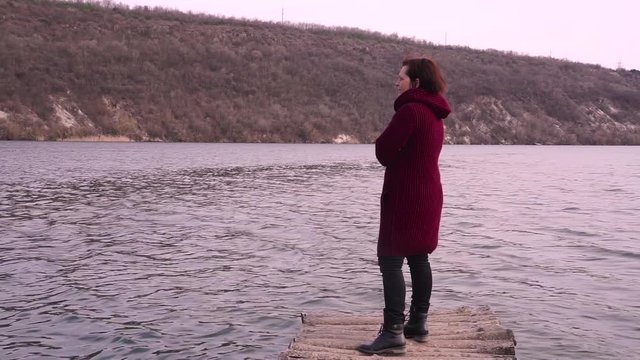 Romantic woman on a old bridge and looking at her