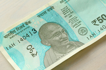 A new banknote of India with a denomination of 50 rupees. Indian currency. Portrait of Mahatma...