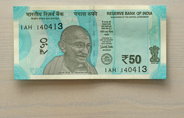 A new banknote of India with a denomination of 50 rupees. Indian currency. Portrait of Mahatma Gandhi