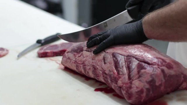 a butcher cutting meat