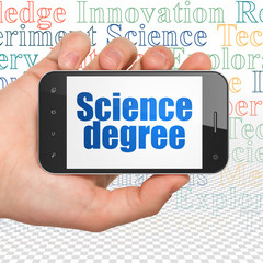 Science concept: Hand Holding Smartphone with  blue text Science Degree on display,  Tag Cloud background, 3D rendering