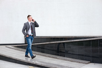 businessman talking on the phone while walking