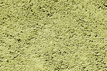 Cement wall texture in yellow tone.